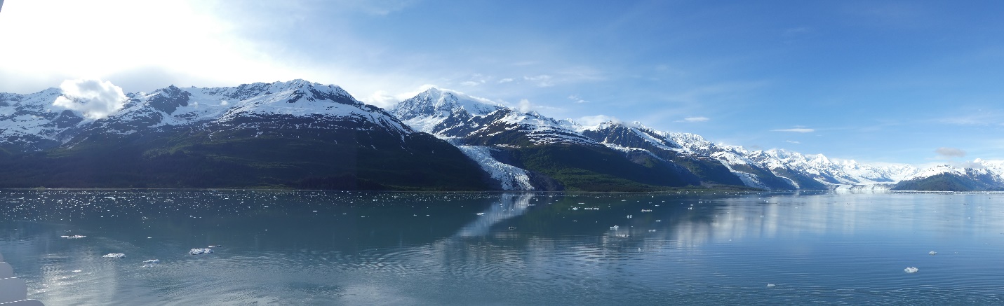 A body of water with mountains in the background Description automatically generated with medium confidence