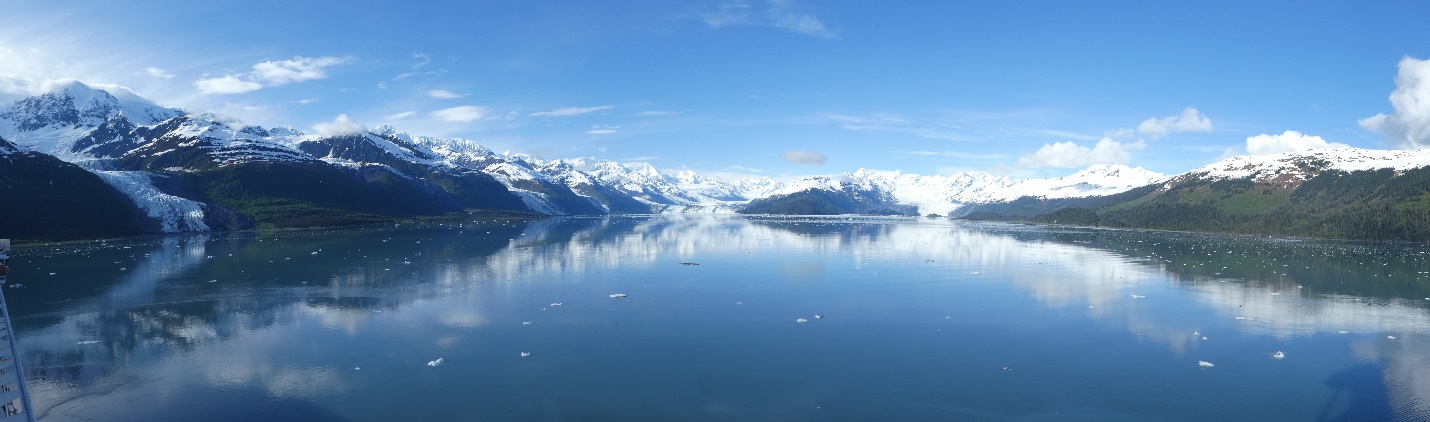 A lake with mountains in the background Description automatically generated with low confidence